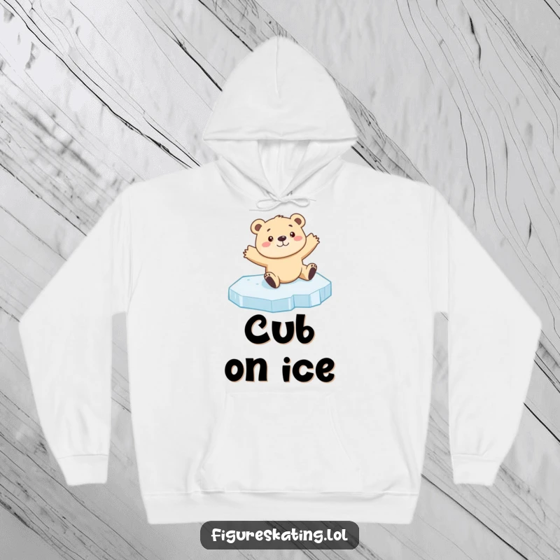 Funny bear cub ice skating hoodie featuring a curious cub sliding on ice with arms outstretched, perfect for cozy, humorous wear.