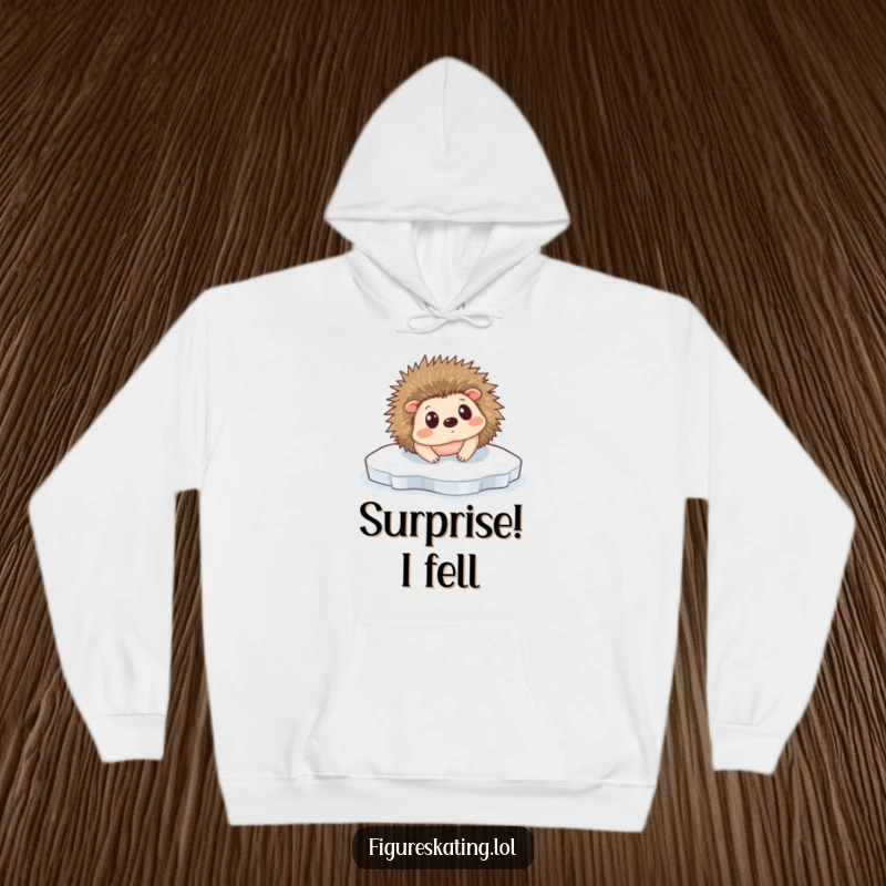 Funny Hedgehog Ice Slip Hoodie: A tiny hedgehog comically slipping on ice, looking surprised, perfect for cozy wear.
