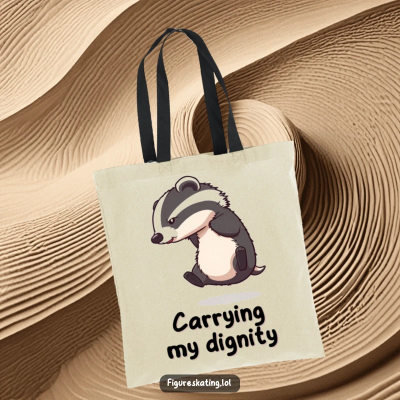 Funny tote bag featuring a determined badger falling during an ice skating spin, a comical scene.